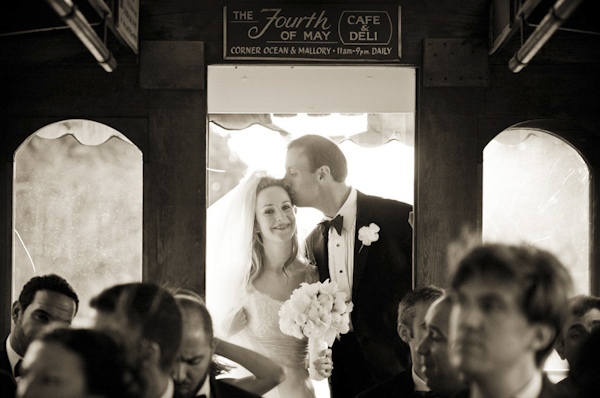 The groom kissing the smiling bride - wedding photo by top Atlanta-based wedding photographer Scott Hopkins Photography